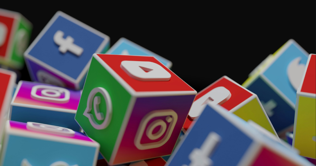 3D social media icons grouped together to show the versatility of an AI social media post generator.