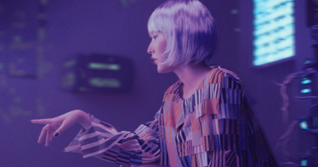 A woman with a white bob haircut in a purple-lit futuristic environment, representing the creative output of an Artificial Intelligence photo generator.