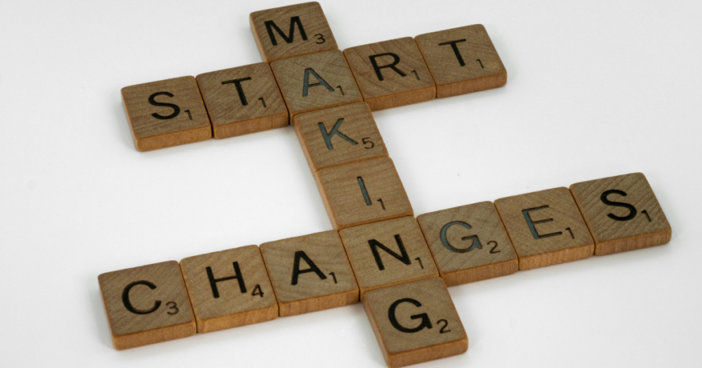 Scrabble tiles spelling out "START MAKING CHANGES," representing the shift toward artificial intelligence and digital marketing innovation in 2026.